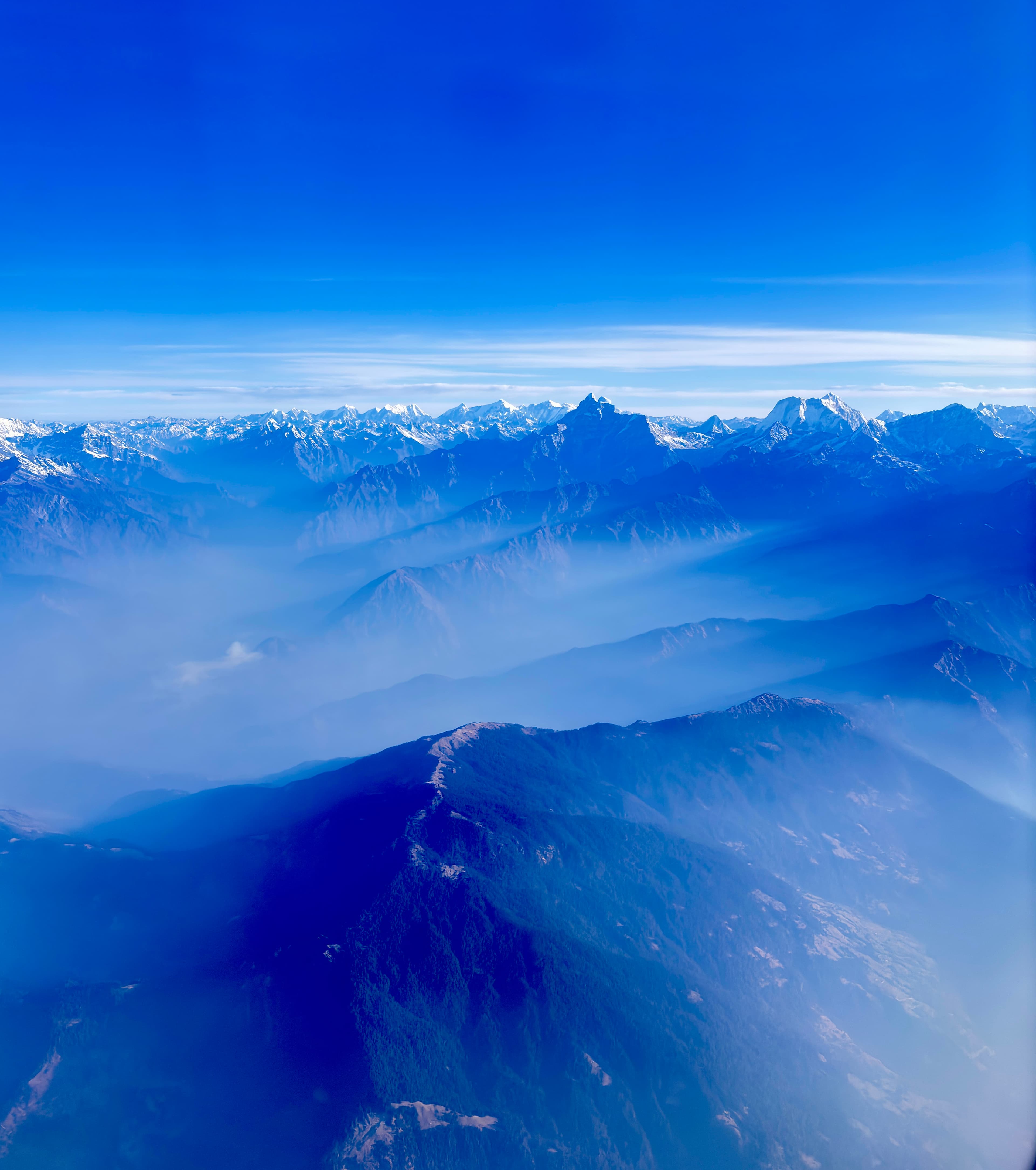 Aerial view of a snow-capped mountain range from a different angle