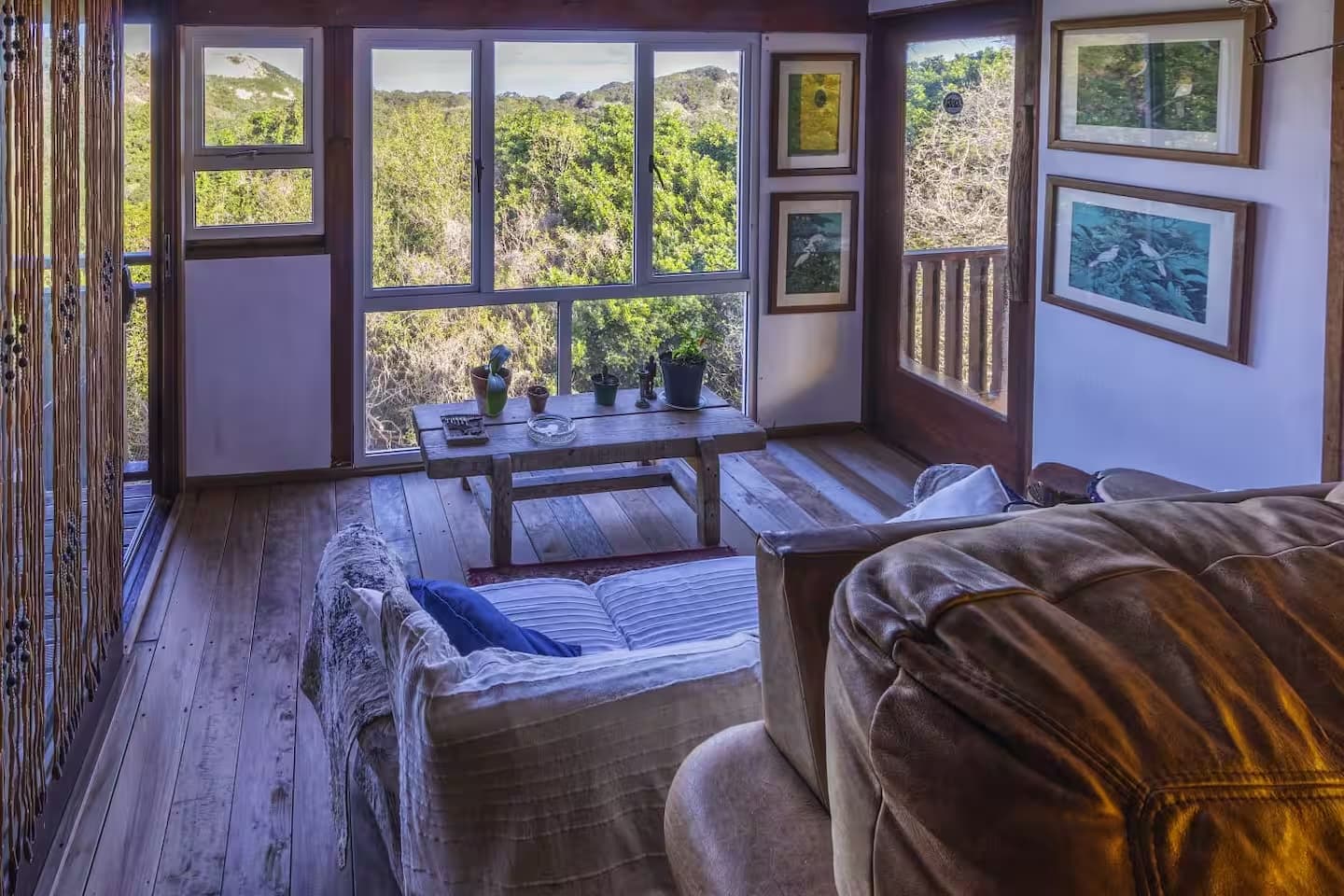 A sitting room in the lodge, looking out over the forest canopy