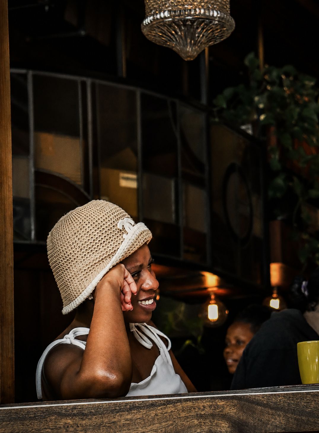 Woman laughing at bar, candid human connection